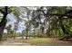 Back yard view with mature trees and pond at 1030 Waccamaw Lake Dr., Conway, SC 29526