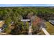 Scenic aerial view of the property surrounded by lush greenery and trees at 1068 Harbor Dr., Calabash, NC 28467