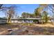 View of the rear of the home with a spacious yard, ideal for outdoor activities at 1068 Harbor Dr., Calabash, NC 28467
