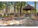 Enjoy the backyard with a charming gazebo and fire pit, perfect for outdoor gatherings at 1068 Harbor Dr., Calabash, NC 28467