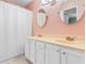 Functional bathroom with double sinks, vanity, and shower-tub combo at 1068 Harbor Dr., Calabash, NC 28467