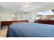 Relaxing bedroom featuring a comfortable bed, television, and ample closet space at 1068 Harbor Dr., Calabash, NC 28467