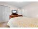 Cozy bedroom featuring a wooden bed frame, TV, closet and neutral walls, creating a relaxing atmosphere at 1068 Harbor Dr., Calabash, NC 28467