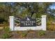 Welcome to Hunters Trace, a beautiful community sign amidst well-maintained landscaping at 1068 Harbor Dr., Calabash, NC 28467