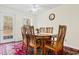 Formal dining area featuring a large wooden table and a view to the backyard at 1068 Harbor Dr., Calabash, NC 28467