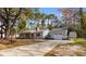 Charming single-story home with a long driveway and a detached two-car garage at 1068 Harbor Dr., Calabash, NC 28467