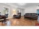 Comfortable living room features wood floors, cozy seating and bright windows at 1068 Harbor Dr., Calabash, NC 28467