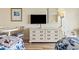 Cozy bedroom featuring a dresser with television and comfortable sleeping arrangements at 1207 S Ocean Blvd. # 51006, Myrtle Beach, SC 29577