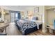 Inviting bedroom featuring two beds, balcony access, and a built-in safe at 1207 S Ocean Blvd. # 51006, Myrtle Beach, SC 29577