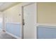 Hallway with blue and neutral colored walls and suite number 5106 is visible at 1207 S Ocean Blvd. # 51006, Myrtle Beach, SC 29577