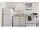 A cozy kitchen features white appliances, cabinets, and countertop space at 1207 S Ocean Blvd. # 51006, Myrtle Beach, SC 29577