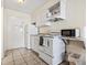 Compact kitchen with white appliances including a range, microwave, and refrigerator at 1207 S Ocean Blvd. # 51006, Myrtle Beach, SC 29577