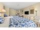 Inviting room with two beds and floral bedding, a dresser with a TV, and a kitchenette at 1207 S Ocean Blvd. # 51006, Myrtle Beach, SC 29577