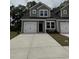 Charming two-story home with attached garage and concrete driveway, perfect for a modern living at 1211 American Shad Dr. # 36, Conway, SC 29526