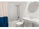 Bright bathroom with updated vanity, fixtures, and shower with curtain at 1287 Stalvey Ave., Myrtle Beach, SC 29577