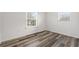 Cozy bedroom with modern flooring and natural light from windows at 1287 Stalvey Ave., Myrtle Beach, SC 29577