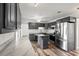 Modern kitchen featuring stainless steel appliances, gray cabinets, a kitchen island, and marble countertops at 1287 Stalvey Ave., Myrtle Beach, SC 29577
