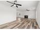 Spacious living room featuring modern floors, a fireplace, recessed lighting, and ceiling fans at 1287 Stalvey Ave., Myrtle Beach, SC 29577