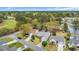 Aerial view of a house near a golf course and pond, surrounded by mature trees at 1292 Merion Ct., Murrells Inlet, SC 29576