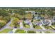 Aerial view of a residential area, featuring a lake and green trees at 1292 Merion Ct., Murrells Inlet, SC 29576