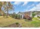 Green backyard with manicured lawn and ornamental trees at 1292 Merion Ct., Murrells Inlet, SC 29576