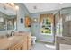Well-lit bathroom with a vanity, toilet, and a shower behind a glass enclosure at 1292 Merion Ct., Murrells Inlet, SC 29576