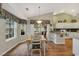 Bright dining area next to an open kitchen with lots of sunlight and seating for four at 1292 Merion Ct., Murrells Inlet, SC 29576
