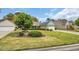 Well-maintained single-story home features lush green lawn and a driveway leading to the attached garage at 1292 Merion Ct., Murrells Inlet, SC 29576