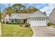 Attractive home with manicured lawn and a convenient driveway leading to the attached two-car garage at 1292 Merion Ct., Murrells Inlet, SC 29576