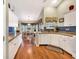 Open concept kitchen with breakfast bar next to a bright and sunny dining area at 1292 Merion Ct., Murrells Inlet, SC 29576