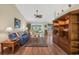 Open-concept living room featuring a ceiling fan, wood floors, and lots of comfortable seating at 1292 Merion Ct., Murrells Inlet, SC 29576
