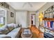 Comfortable living room with hardwood floors, a neutral sofa, and a ceiling fan at 1292 Merion Ct., Murrells Inlet, SC 29576