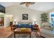 Cozy living room with vaulted ceilings, a ceiling fan, comfortable seating, and wood floors at 1292 Merion Ct., Murrells Inlet, SC 29576