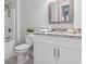 Bathroom featuring marble countertop, toilet and shower with tiled walls at 1312 Ashboro Ct., Myrtle Beach, SC 29579