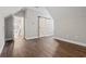 A bedroom featuring a sliding barn door and wood flooring at 1312 Ashboro Ct., Myrtle Beach, SC 29579