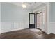 Inviting foyer with elegant wainscoting, hardwood floors, and ample natural light at 1312 Ashboro Ct., Myrtle Beach, SC 29579
