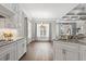 Open kitchen and breakfast area with white cabinets, granite countertops and dining area at 1312 Ashboro Ct., Myrtle Beach, SC 29579