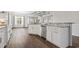 Kitchen with white cabinetry, granite countertops and stainless steel appliances; open floor plan at 1312 Ashboro Ct., Myrtle Beach, SC 29579
