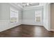Bright living room with decorative molding, two windows and hardwood floors at 1312 Ashboro Ct., Myrtle Beach, SC 29579