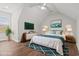 Bright main bedroom featuring a bed, ceiling fan, and large window at 1312 Ashboro Ct., Myrtle Beach, SC 29579