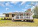 Backyard view showcasing brick home, a charming gazebo, and a well-manicured lawn at 1421 Cottesmore Ct., North Myrtle Beach, SC 29582