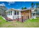 Lovely backyard with a wooden deck, well-maintained lawn, and a charming mix of brick and siding on the home's exterior at 144 Pink Dogwood Dr., Loris, SC 29569