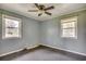 Bright bedroom with neutral walls, large windows providing ample natural light, and carpet flooring at 144 Pink Dogwood Dr., Loris, SC 29569