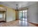 Bright dining room with access to the sunroom via sliding glass doors at 144 Pink Dogwood Dr., Loris, SC 29569