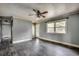 Bright living room with hardwood floors, natural light, and a ceiling fan at 144 Pink Dogwood Dr., Loris, SC 29569