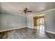 View of the living room with sliding glass doors leading to the sunroom at 144 Pink Dogwood Dr., Loris, SC 29569