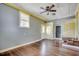Bright living room with hardwood floors, featuring built-in cabinets and a vintage style at 144 Pink Dogwood Dr., Loris, SC 29569