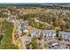 Aerial view of the community featuring well-maintained buildings, a golf course, and lush greenery at 1525 Lanterns Rest Rd. # 304, Myrtle Beach, SC 29579