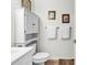 Bathroom features a toilet, built-in storage, and a vanity with a sink at 1525 Lanterns Rest Rd. # 304, Myrtle Beach, SC 29579