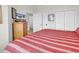 Another view of the bedroom with carpet and a large dresser with a TV at 1525 Lanterns Rest Rd. # 304, Myrtle Beach, SC 29579